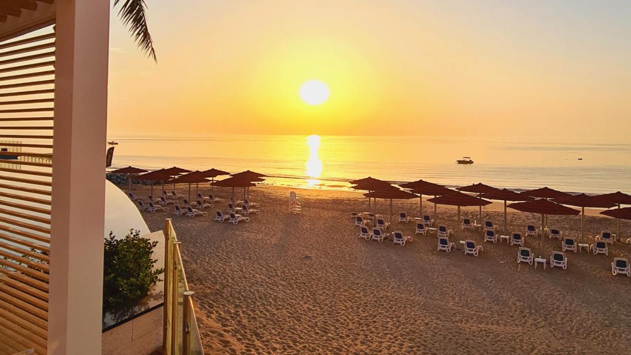 Royal M Al Aqah Beach Resort By Gewan Екстер'єр фото Sunset at the beach